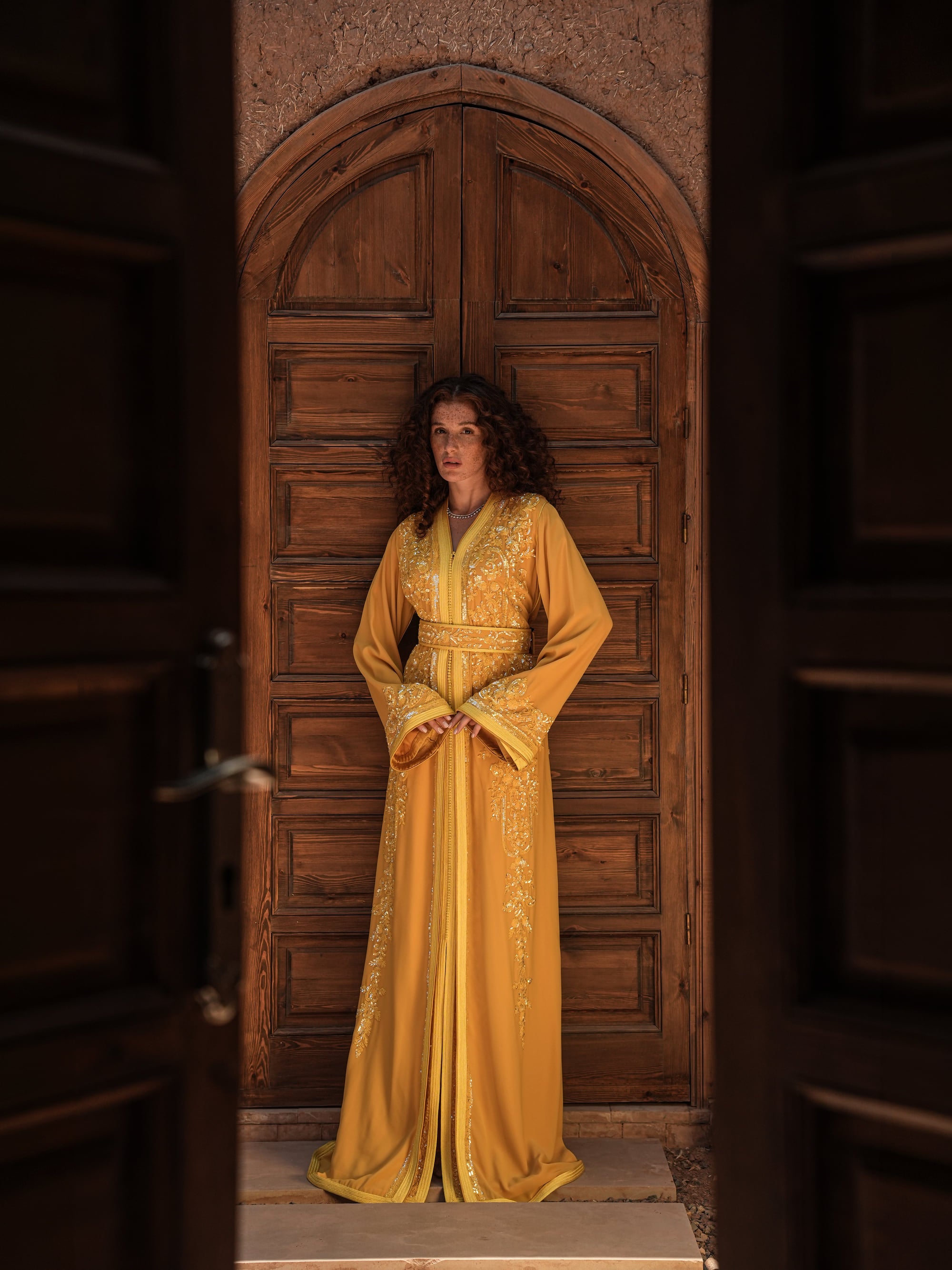 Saffron Vespers saffron crepe Moroccan kaftan with gold and silver embroidery, full-length view