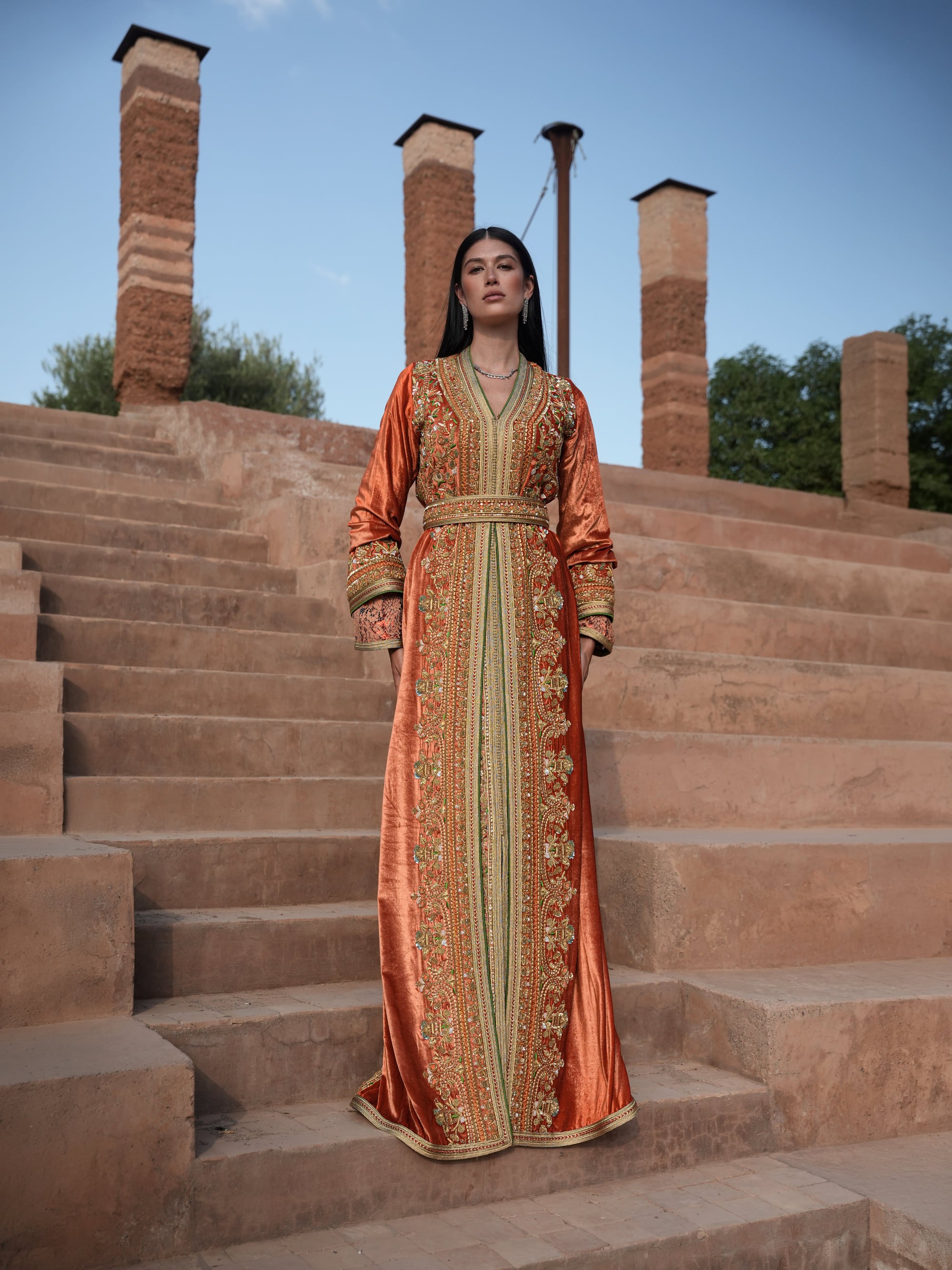 Terracotta Zenith rust velvet Moroccan kaftan with gold and green embroidery, full-length view