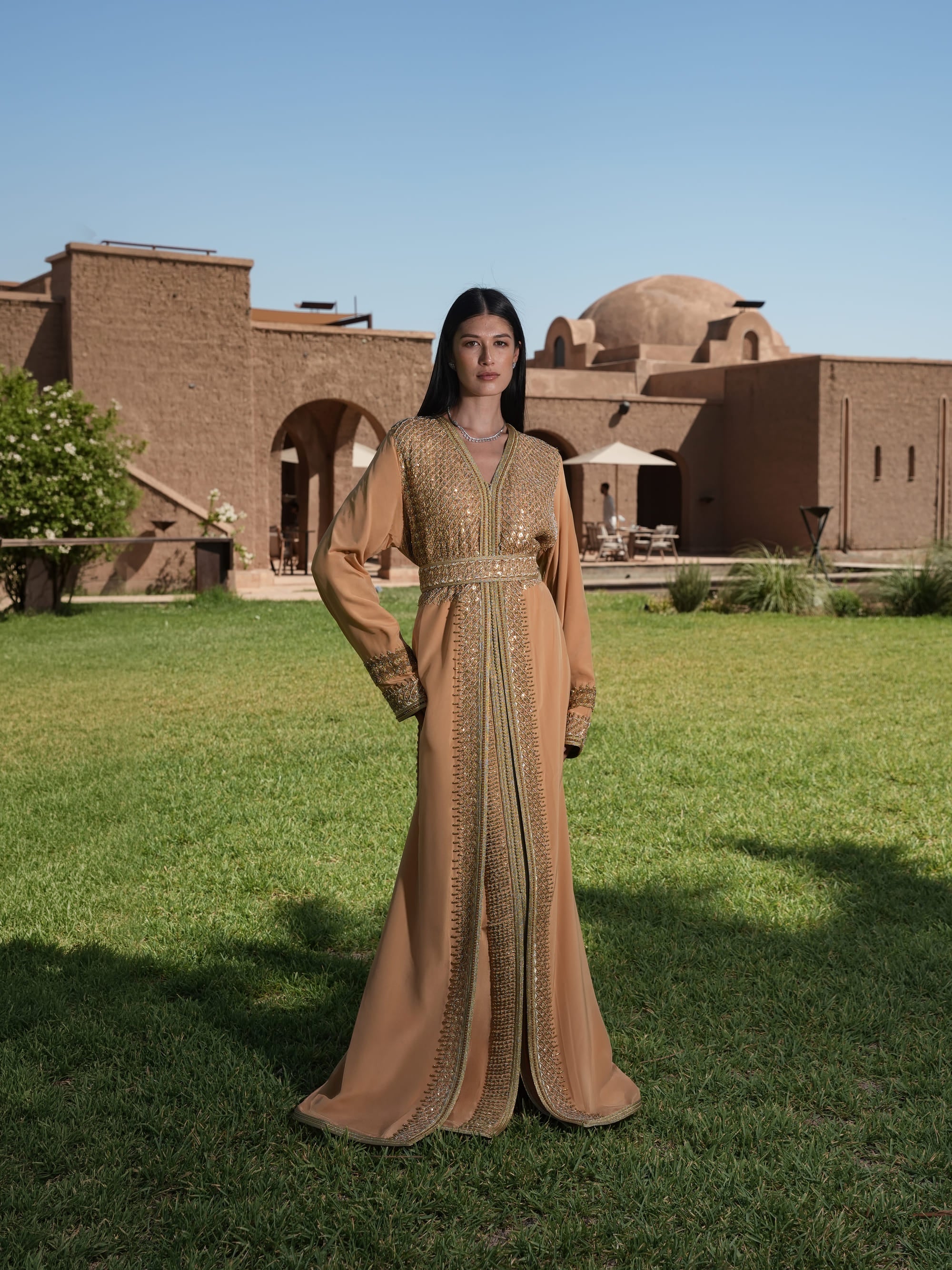 Amber Vigil apricot crepe Moroccan kaftan with a gold sequin mesh plastron at the neckline