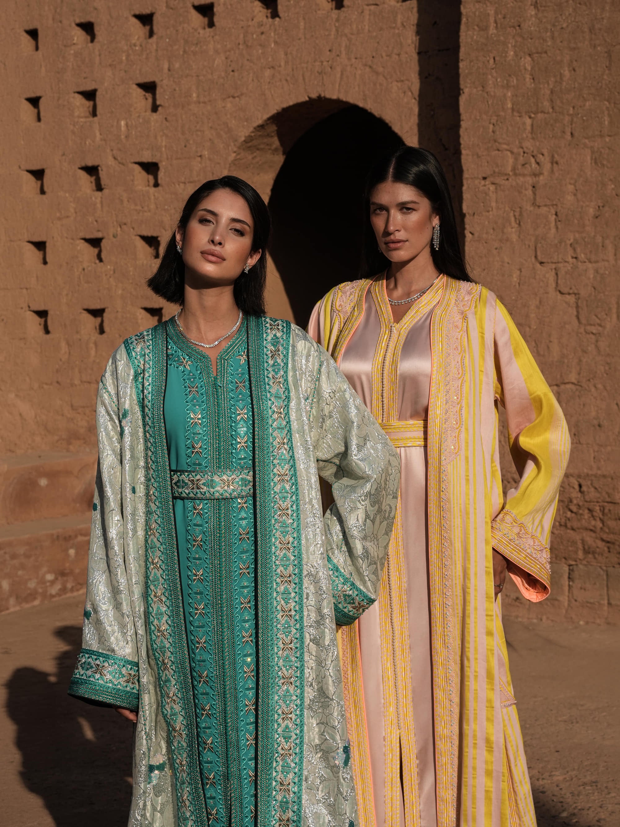 Azure Constellation turquoise Moroccan kaftan with star embroidery under an ivory brocade mansouria, shown alongside a second look