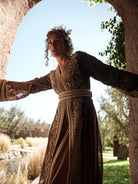 Bronze Reverie lamé organza Moroccan kaftan with gold embroidery, worn open over a champagne dress