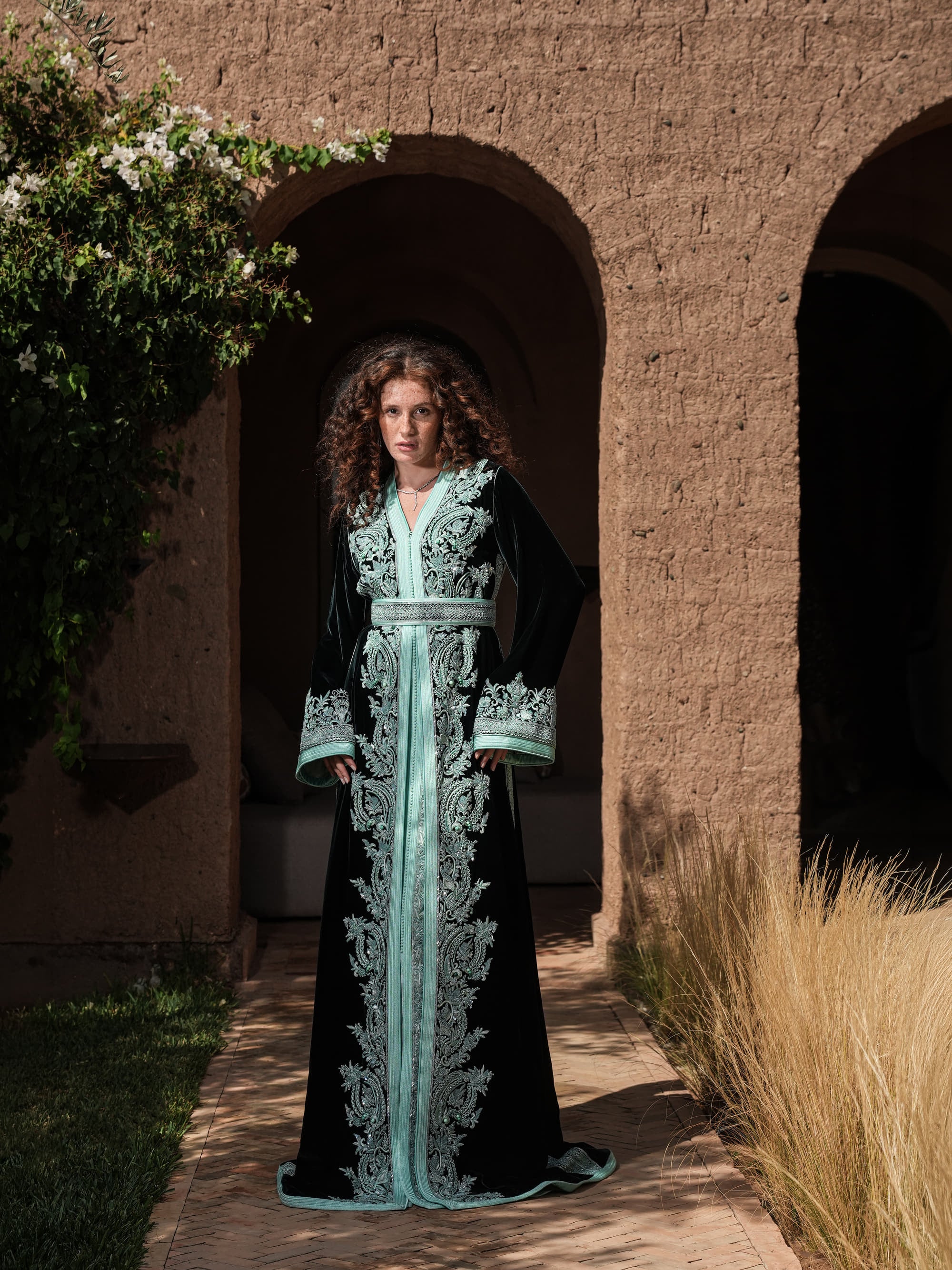 Cypress Portico deep green velvet Moroccan kaftan with sea-green embroidery, full-length view