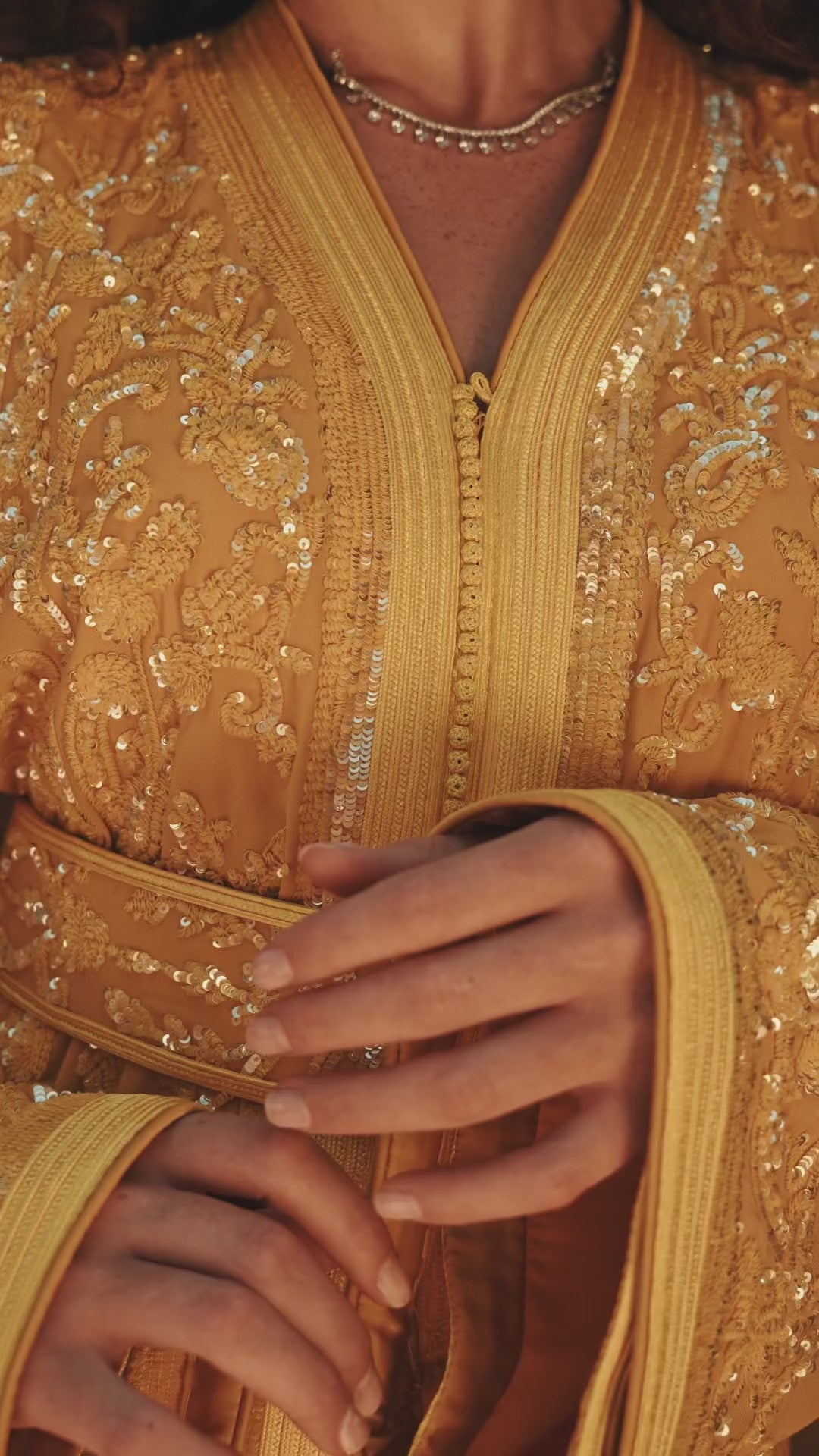 Saffron Vespers saffron crepe Moroccan kaftan with gold and silver embroidery, in motion