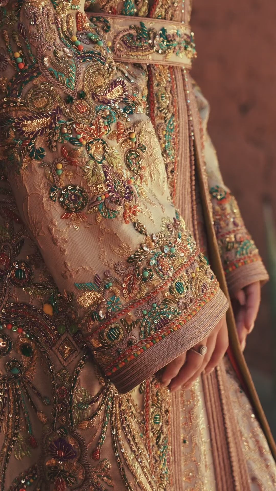 Mosaic Alcove beige silk Moroccan kaftan with polychrome beaded paisley embroidery in a Persian garden motif, in motion
