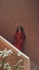 Garnet Adagio burgundy velvet Moroccan kaftan with tone-on-tone embroidery, matching belt and wide sleeves, in motion