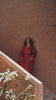 Garnet Adagio burgundy velvet Moroccan kaftan with tone-on-tone embroidery, matching belt and wide sleeves, in motion