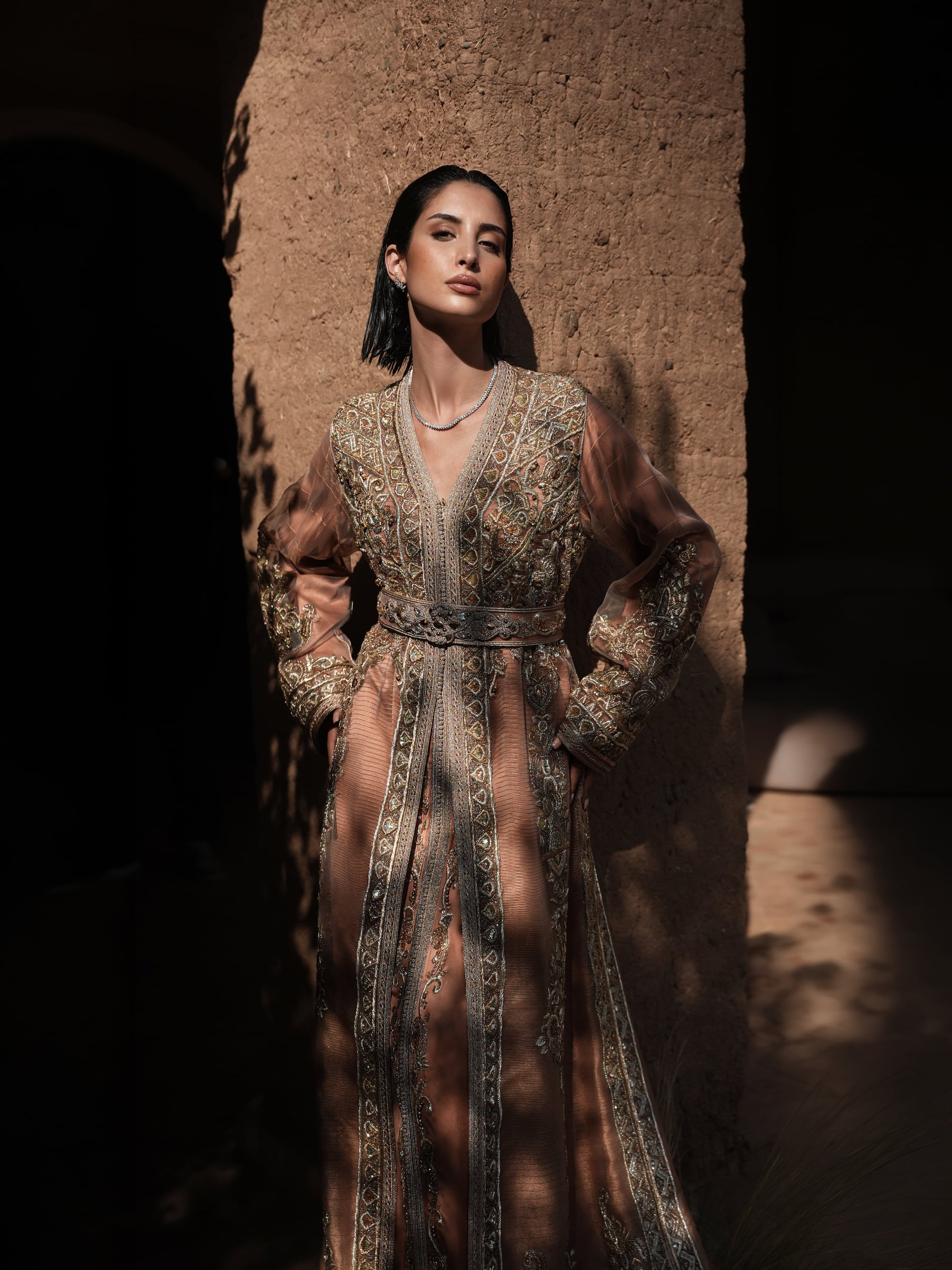 Rosewood Aurora copper-rose organza Moroccan kaftan with silver embroidery and jewelled belt, full-length view